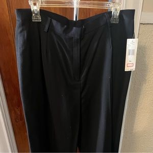 Ladies Jones New York black slacks size 14, lined with wide flare legs.